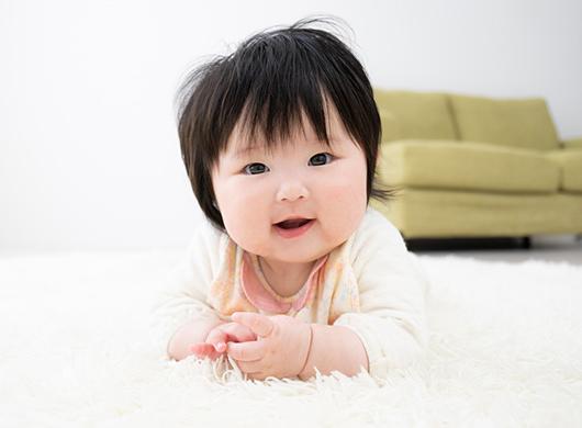 photo of a baby girl on a carpet